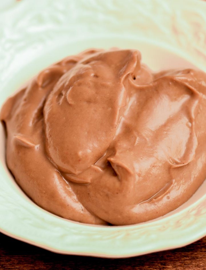 Bowl of creamy chocolate pudding made with avocados. Healthy and delicious!