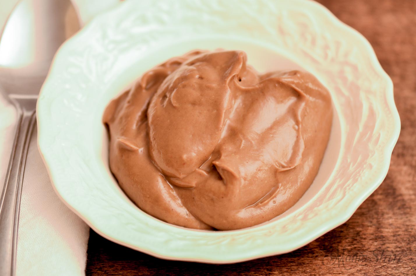 Bowl of creamy chocolate pudding made with avocados. Healthy and delicious! 