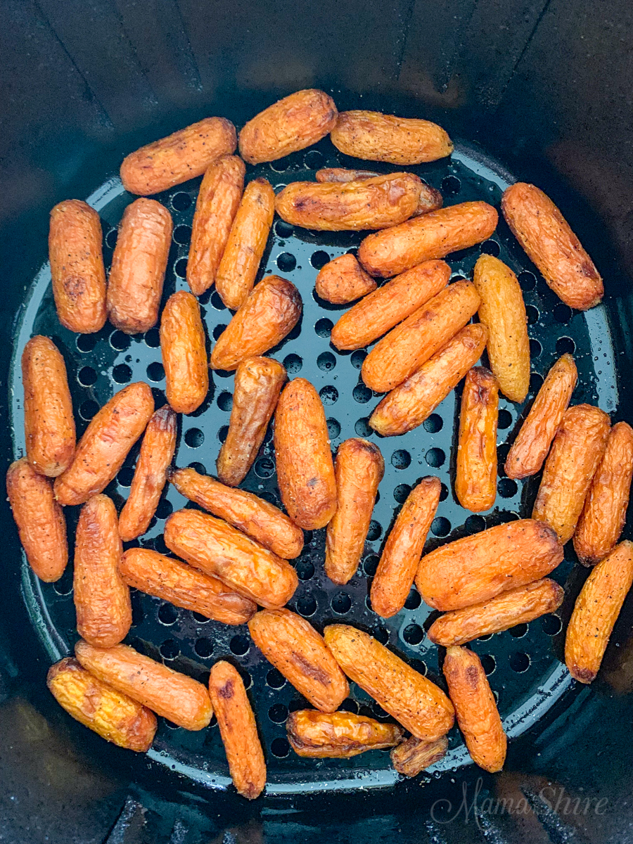 Baby carrots cooked in an air-fryer.