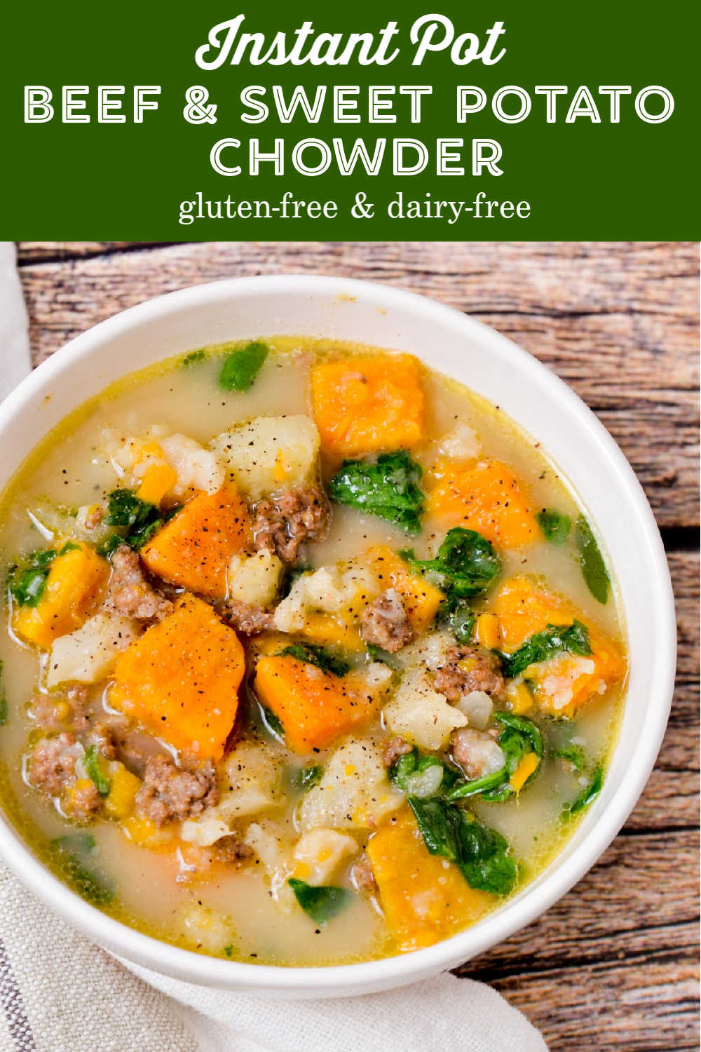 A bowl of gluten-free soup that has beef, sweet potatoes, cauliflower, and spinach.