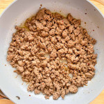 Freshly cooked homemade breakfast beef sausage in a skillet.