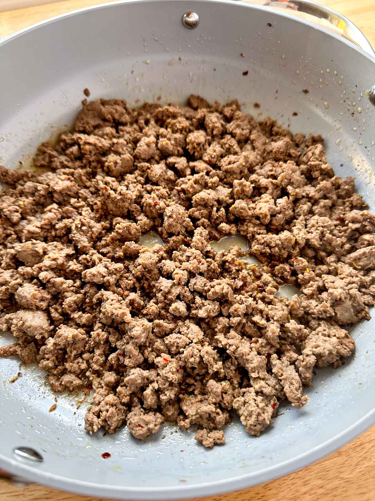 Breakfast sausage made with ground beef in a skillet.