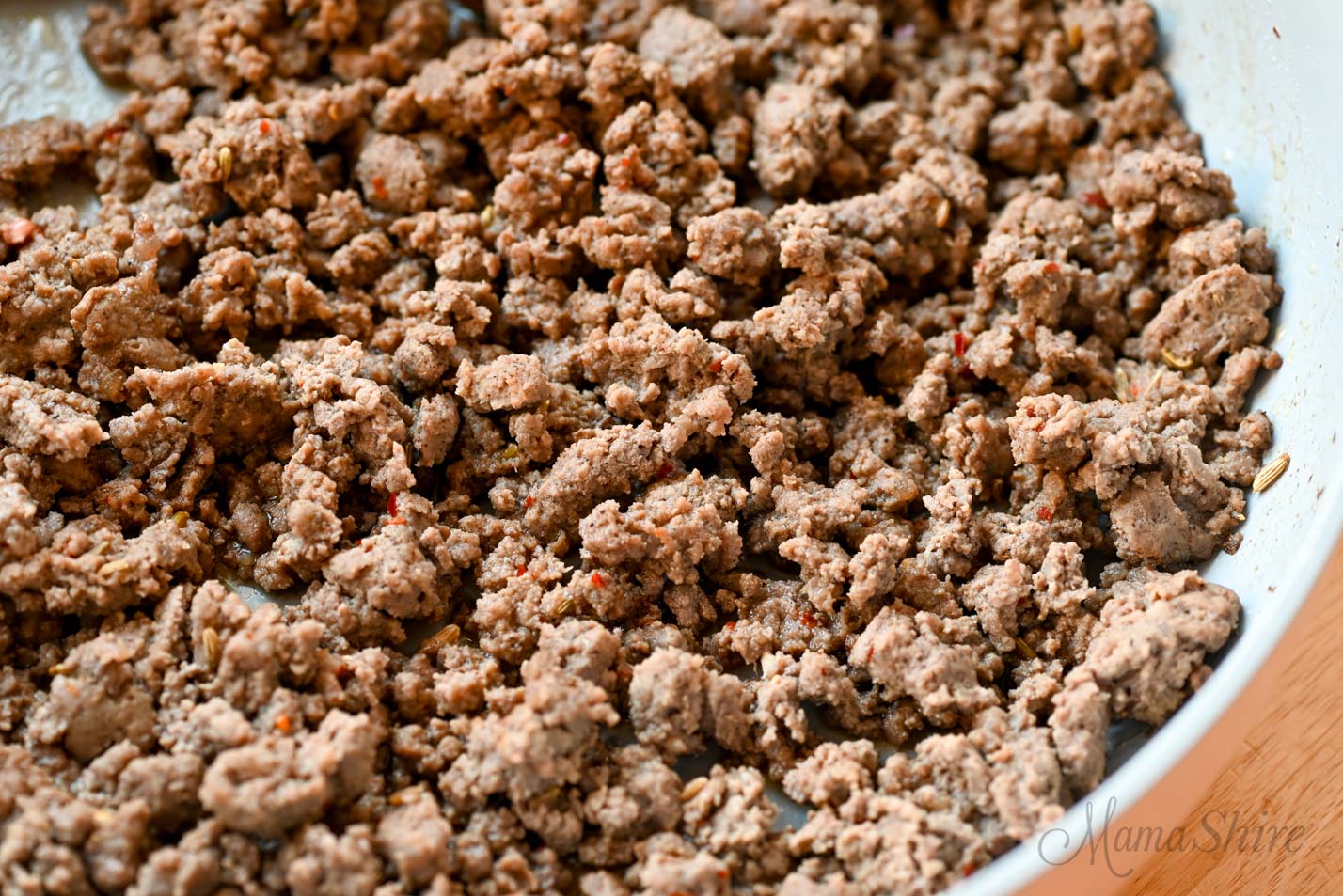 Homemade and gluten-free breakfast beef sausage in a skillet.