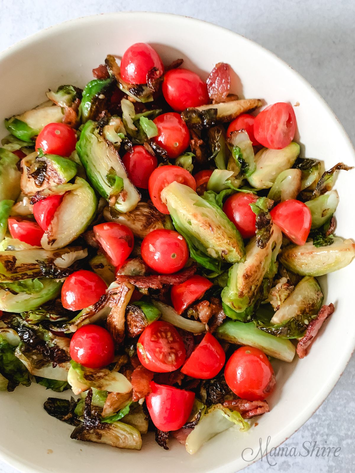 Sauteed Brussels Sprouts with Bacon and Tomatoes. 