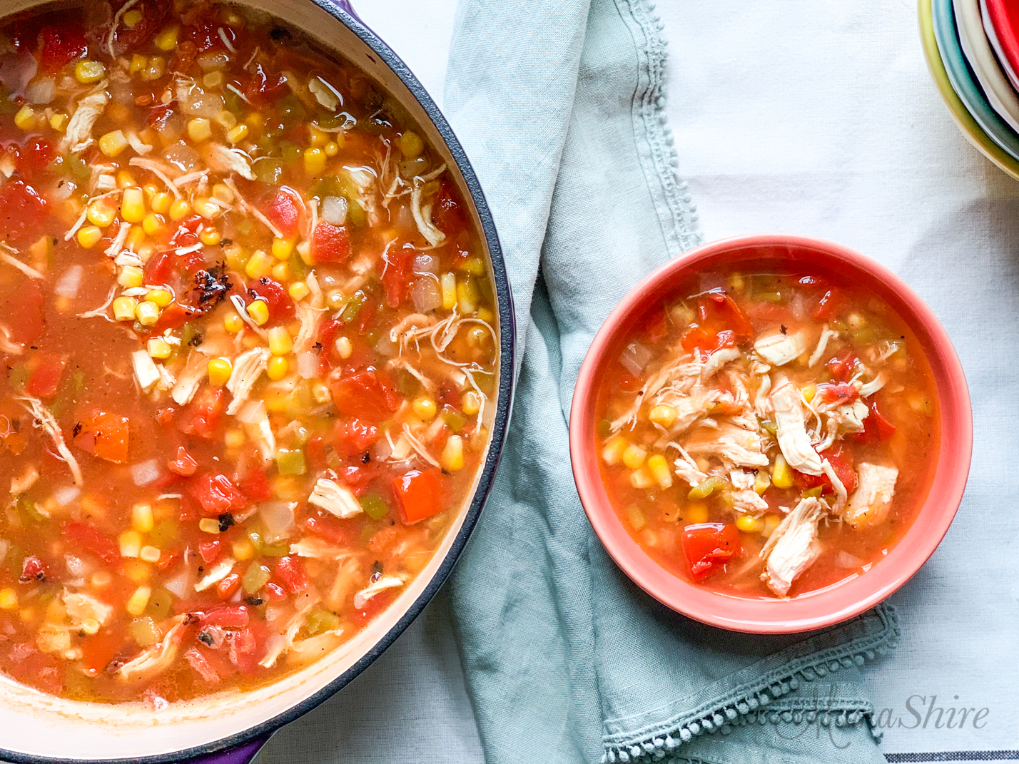 Tasty and easy to make chicken tortilla soup. A serving in a soup bowl and the rest in a large pot.