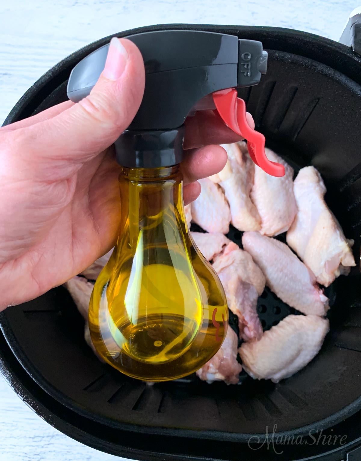 Oil spritzer to spray oil on foods for frying in an air fryer.