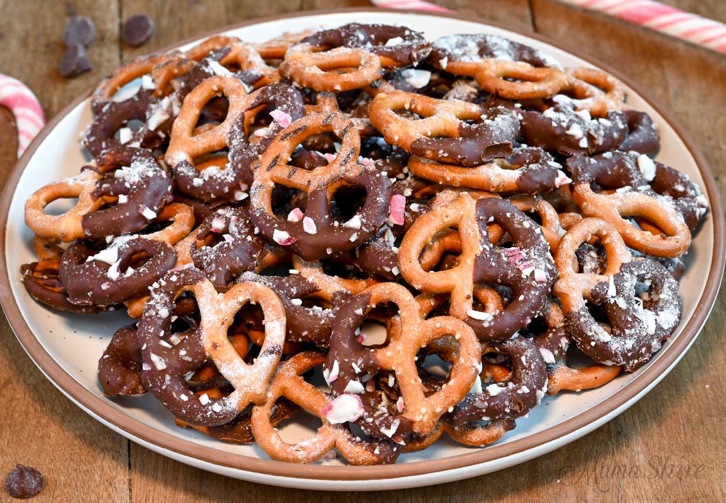 A platter of gluten-free pretzels with chocolate and peppermint candies.