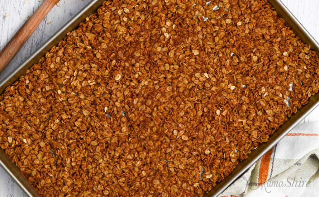 A pan of freshly baked cinnamon granola made with gluten-free rolled oats. 