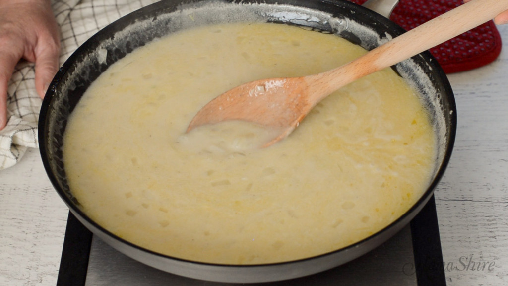 Cooking dairy-free white sauce.