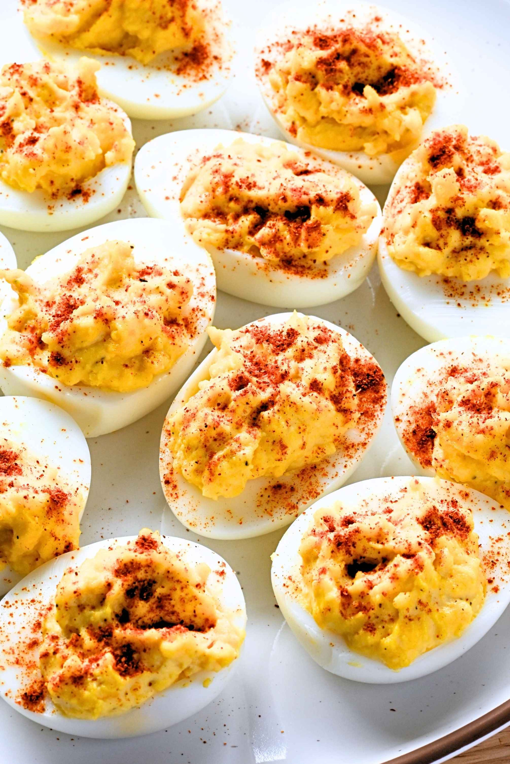 A platter of Deviled Eggs sprinkled with paprika.