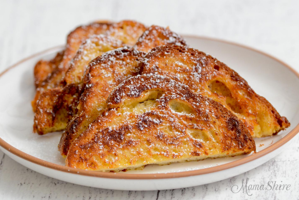 Delicious gluten-free French toast with a sprinkling of powdered sugar.