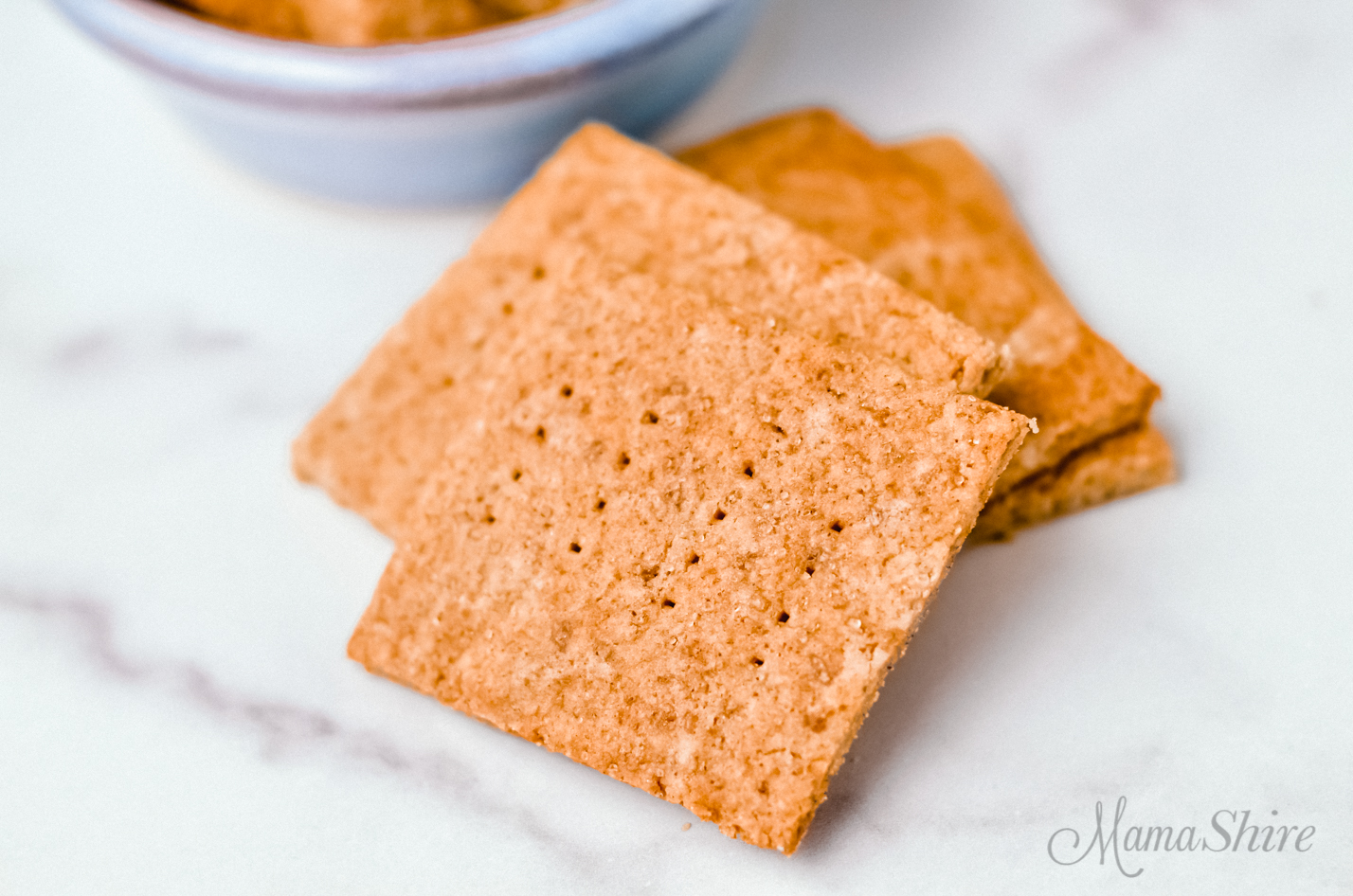 Graham crackers on a marble background. Crackers made with a homemade gluten-free graham cracker recipe.