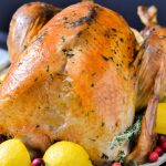 A delicious herb roasted turkey with lemons and herbs.