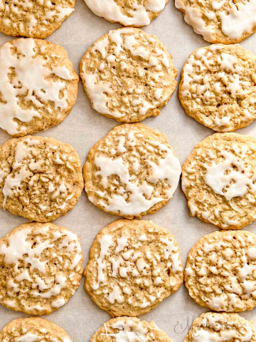 A tray of gluten-free iced oatmeal cookies.