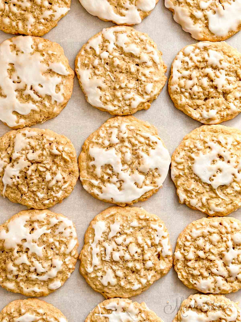 A tray of gluten-free iced oatmeal cookies. 