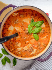 A pot of gluten-free dairy-free lasagna soup with a few basil leaves on top.
