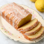 A plate of gluten-free lemon loaf with a few slices sliced.