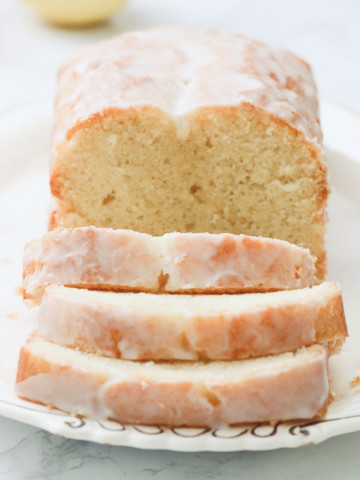 A sliced loaf of gluten-free lemon loaf.