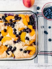 Peaches and blueberries baked together in a cobbler.