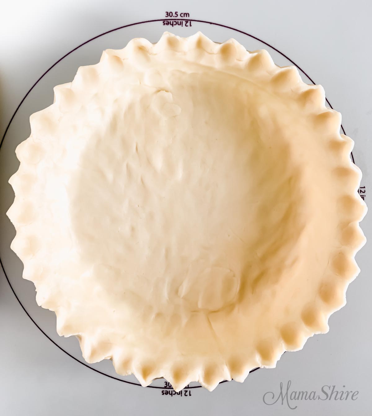 Gluten-free pie crust in a pie pan.