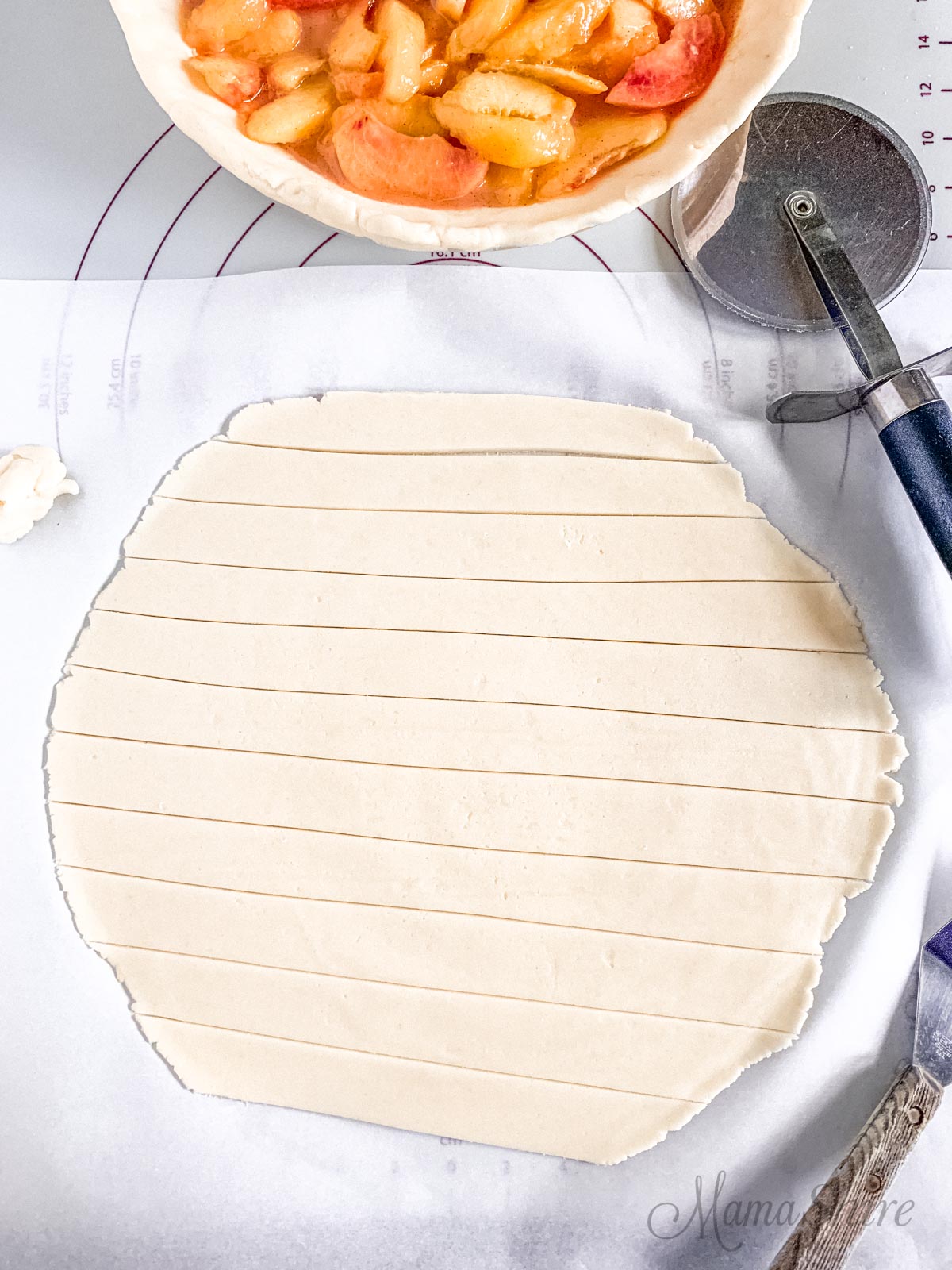 Gluten-free pie crust cut into strips for a lattice top.