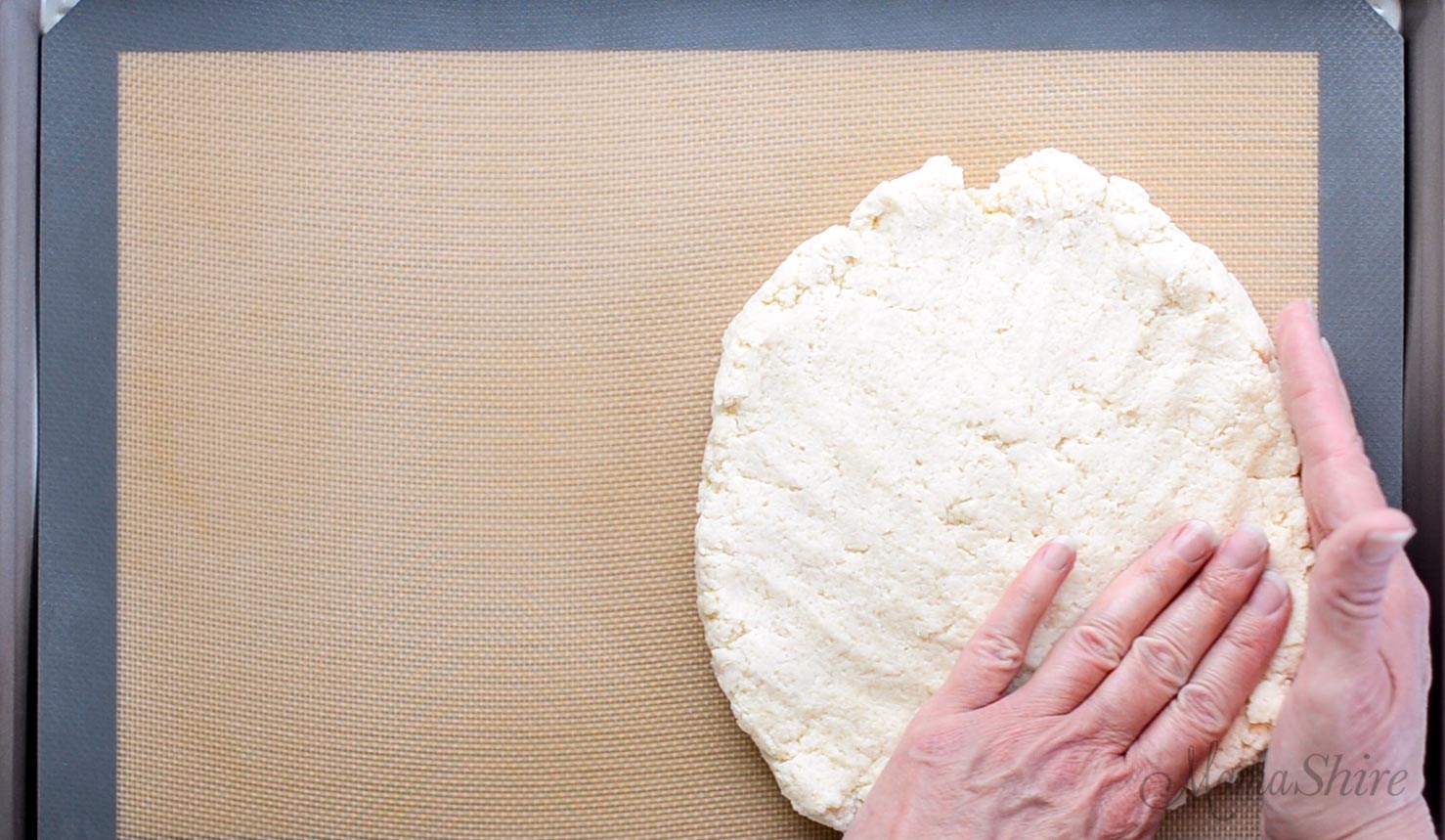 Gluten-free shortcake dough patted out to be cut.