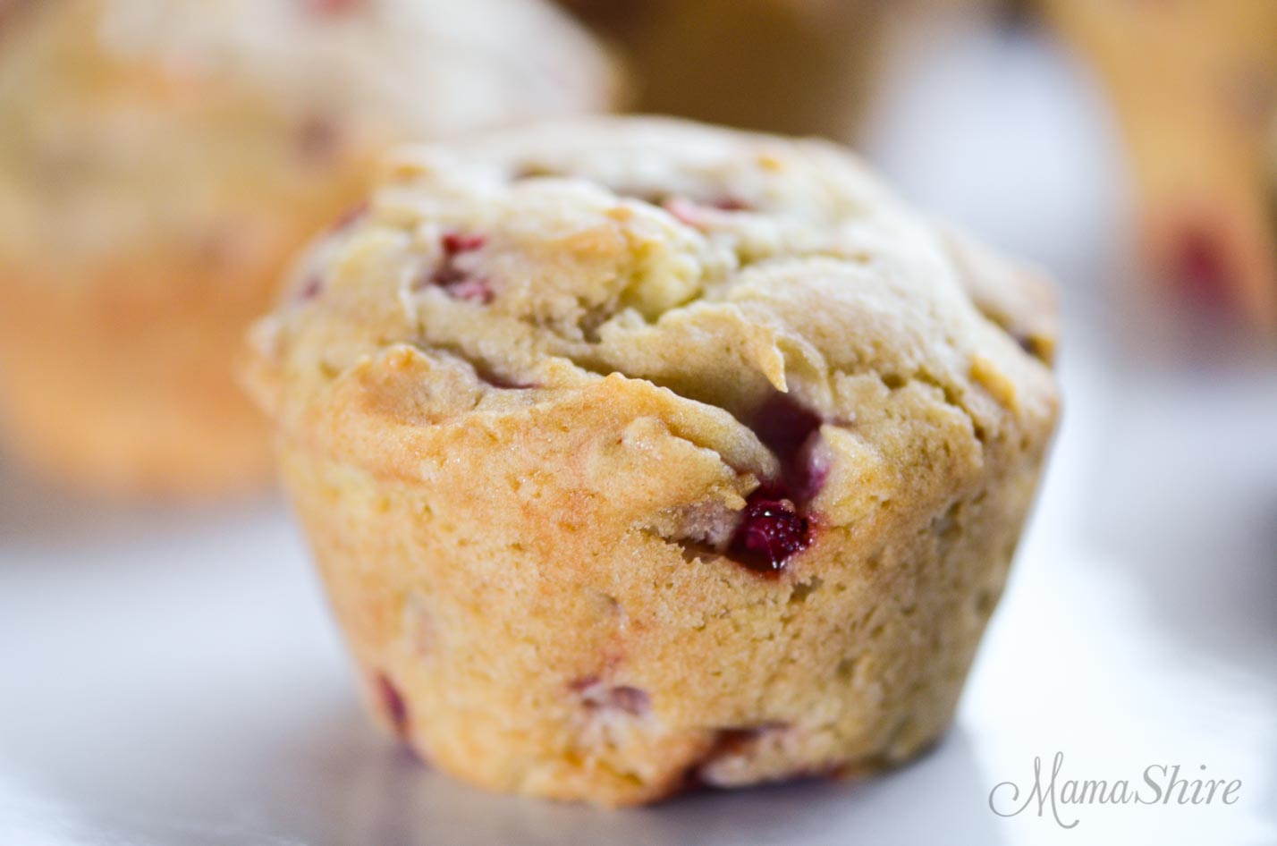 One strawberry muffin made with a gluten-free recipes.