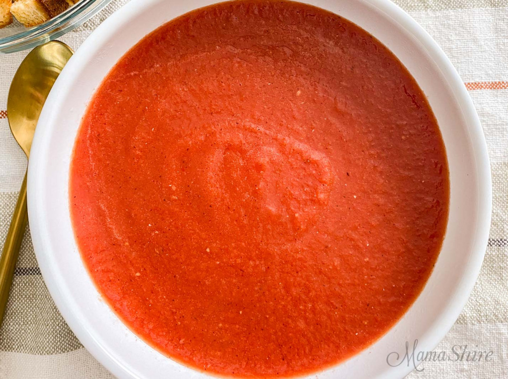 A close-up of a bowl of gluten-free tomato soup.