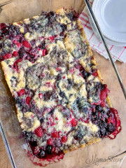 Gluten-Free Triple Berry Cobbler baked in a glass casserole baking pan.