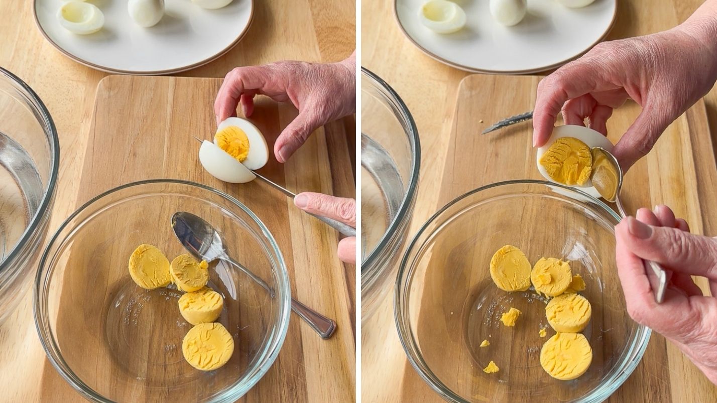 Slicing boiled eggs in half lengthwise and then using a spoon to scoop out the yolk.