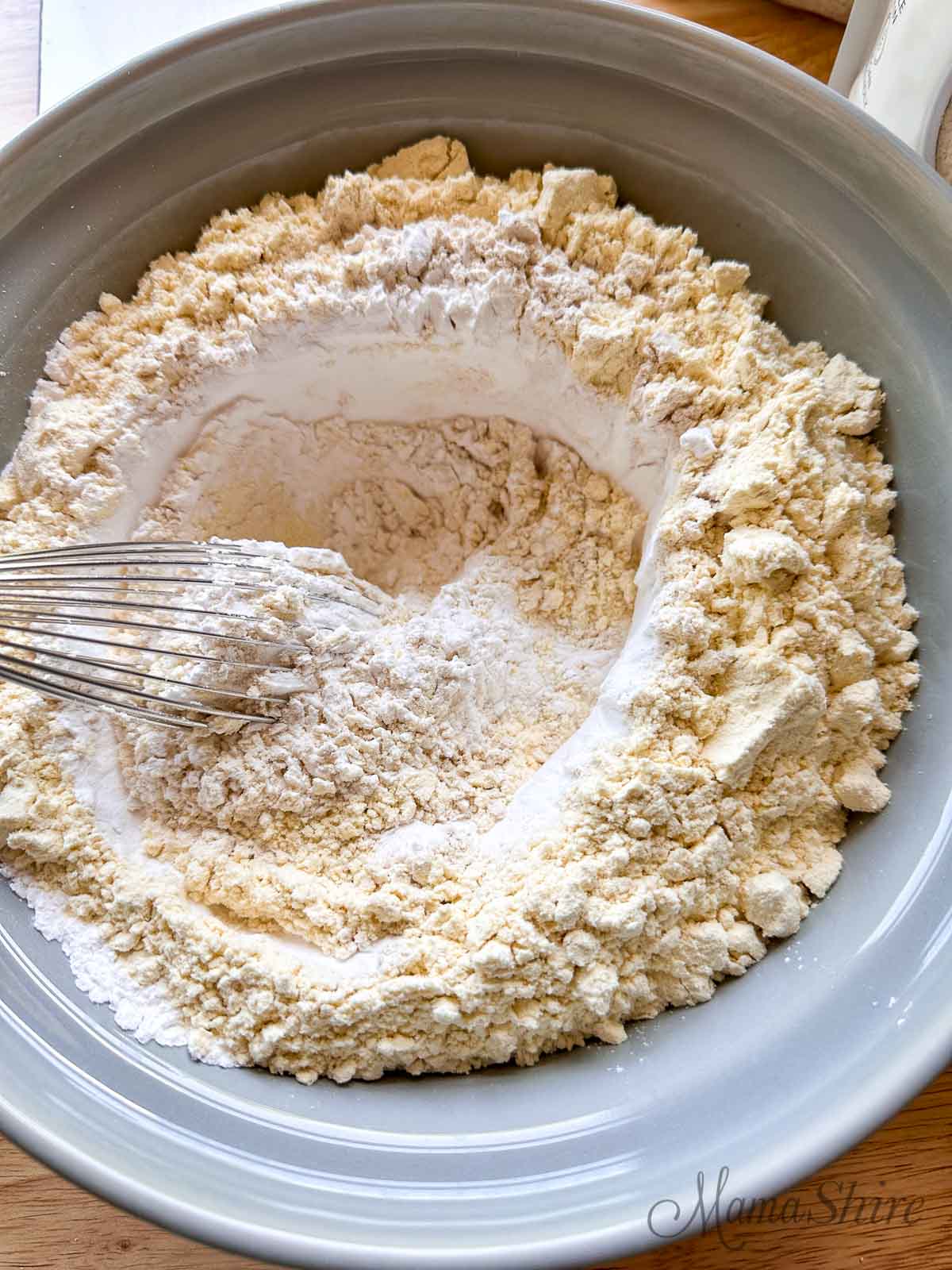 Mixing together my organic gluten-free flour mix with a wire whisk.