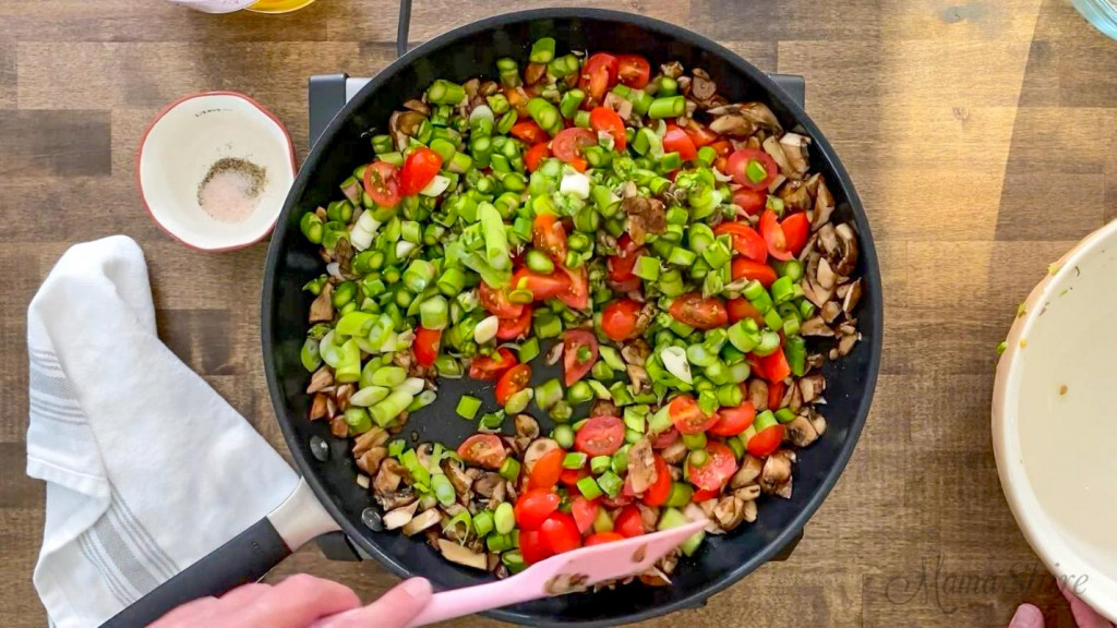 Veggies frying in a non-stick skillet.