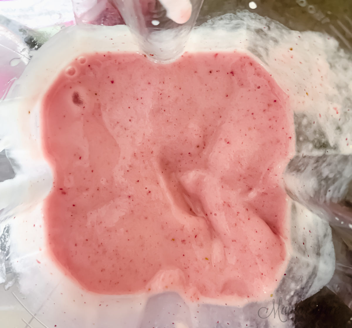 Strawberries, bananas, and dairy-free yogurt in a Vitamix blender.