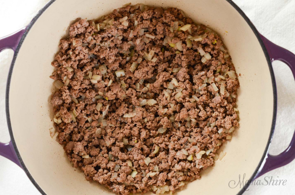 Ground beef browned with onions in a dutch oven.