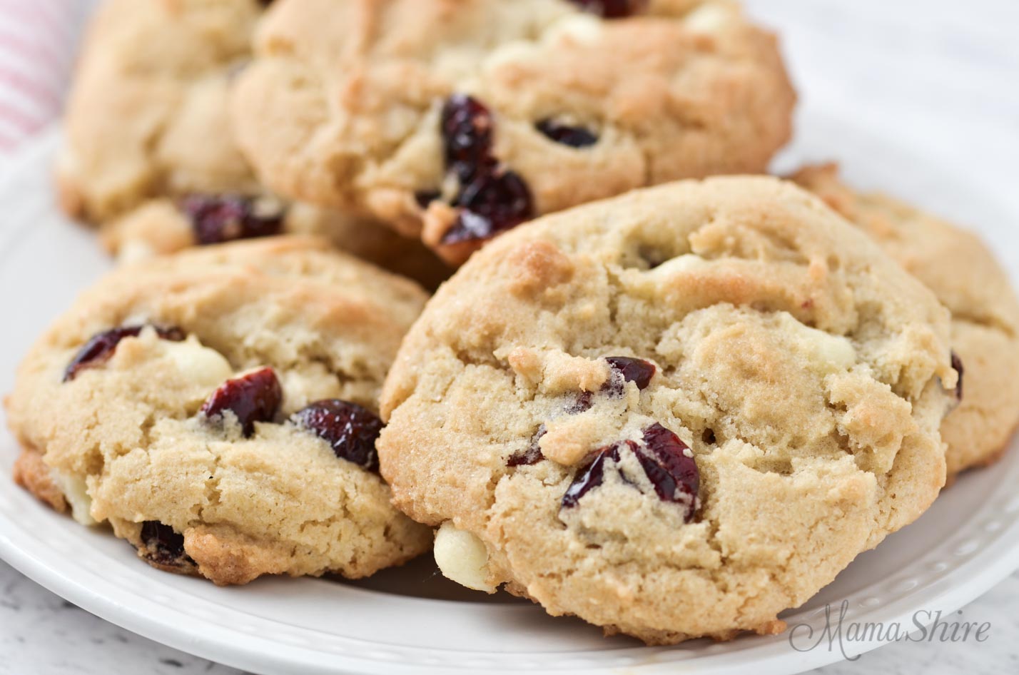 Cookies filled with white chocolate chips and cranberries.